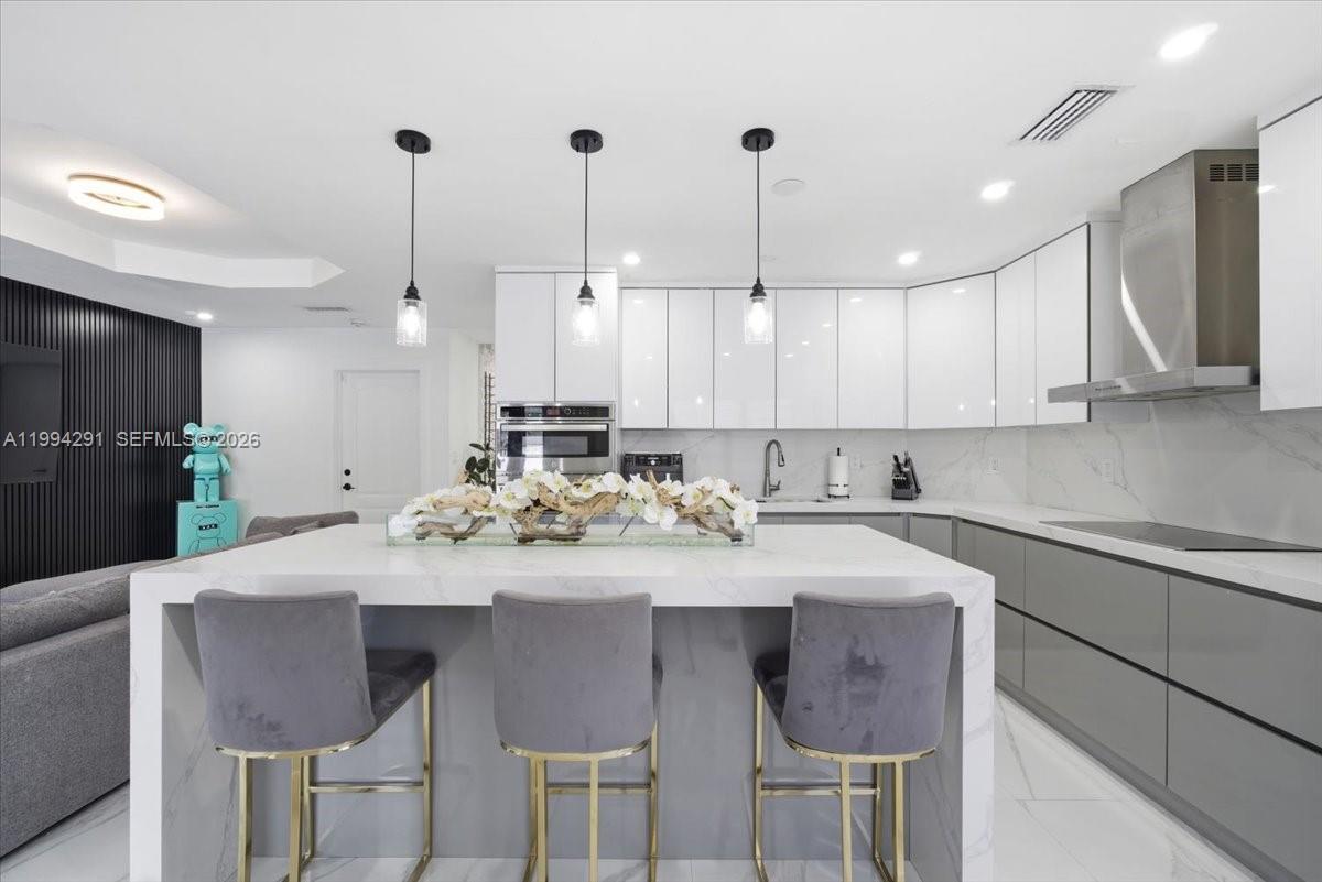 15763 Southwest 43rd Street Miami, FL 33185 - Photo 14 of 46 a kitchen with a sink and cabinets
