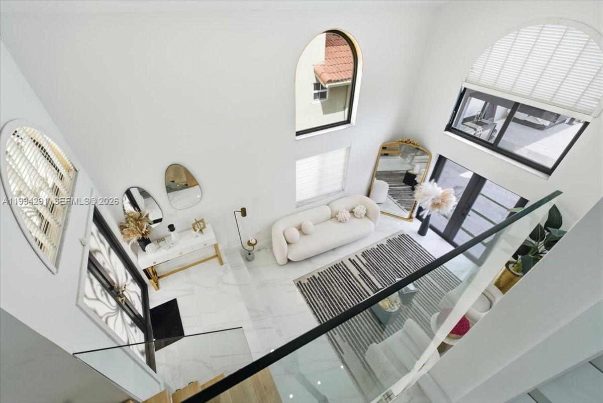 15763 Southwest 43rd Street Miami, FL 33185 - Photo 20 of 46 a view of a living room and dining room