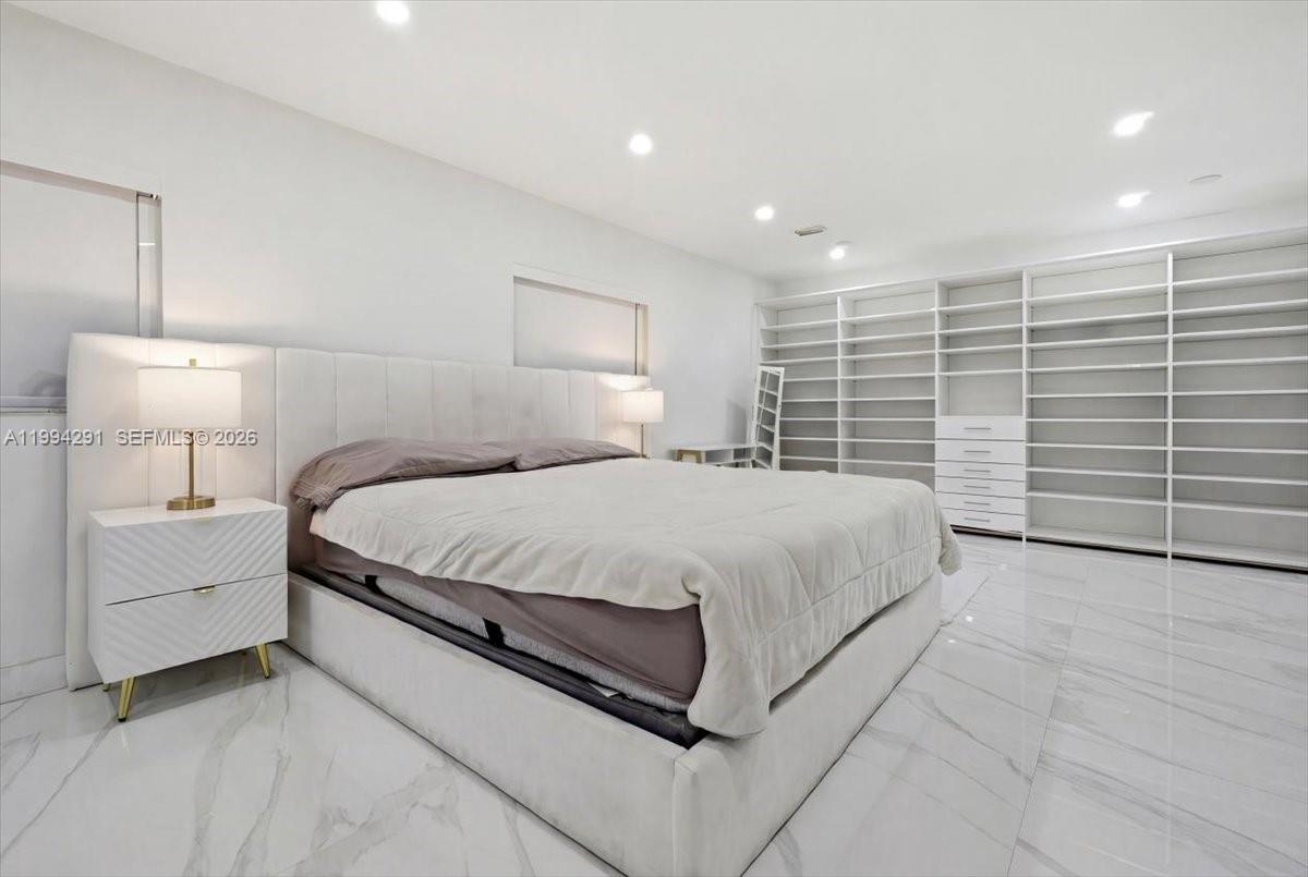 15763 Southwest 43rd Street Miami, FL 33185 - Photo 23 of 46 a large white bed in a white room