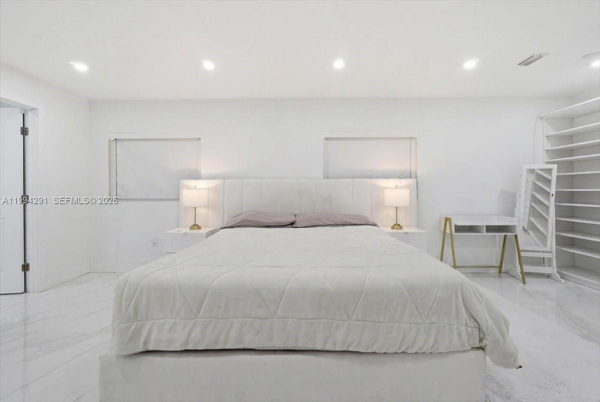 15763 Southwest 43rd Street Miami, FL 33185 - Photo 24 of 46 a bedroom with a bed and chair