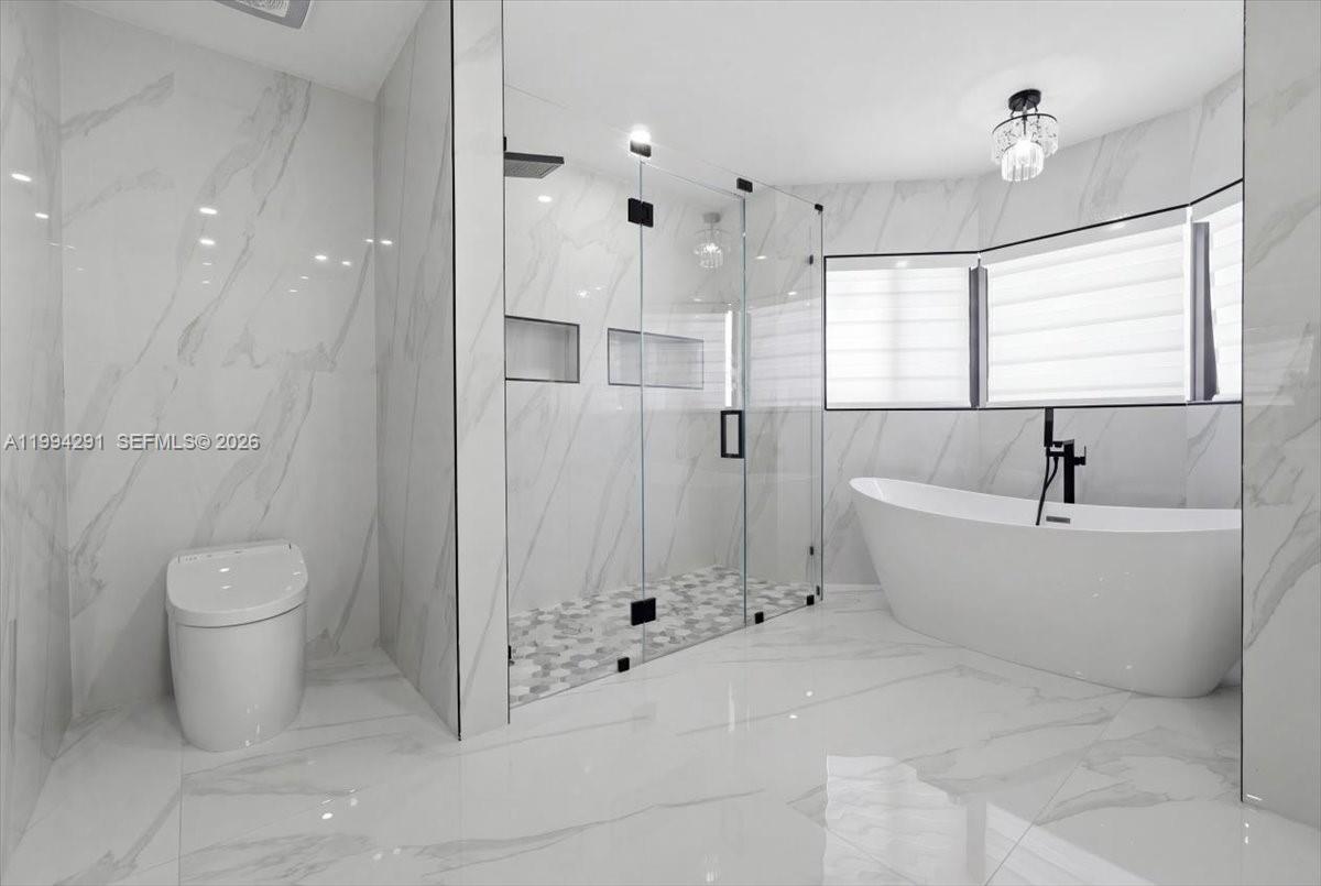 15763 Southwest 43rd Street Miami, FL 33185 - Photo 29 of 46 a bathroom with a bathtub and a shower