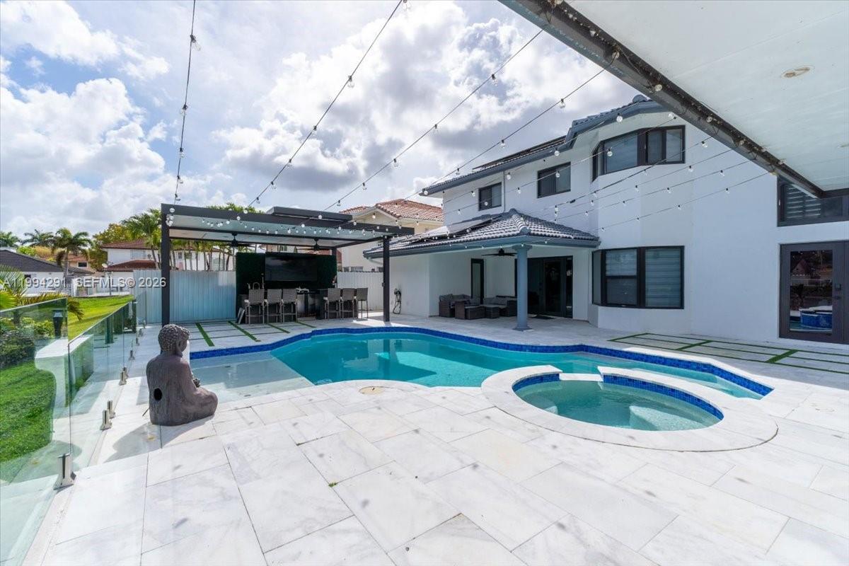 15763 Southwest 43rd Street Miami, FL 33185 - Photo 3 of 46 a view of house with swimming pool outdoor seating