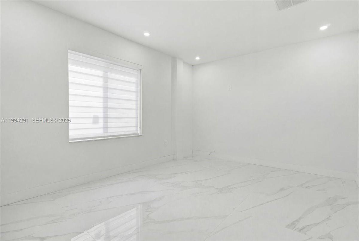 15763 Southwest 43rd Street Miami, FL 33185 - Photo 33 of 46 a view of an empty room with a window