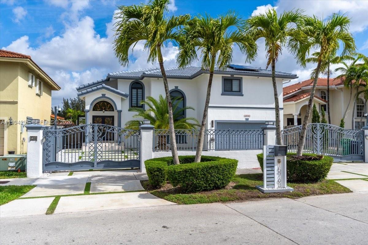 15763 Southwest 43rd Street Miami, FL 33185 - Photo 39 of 46 a front view of a house with garden