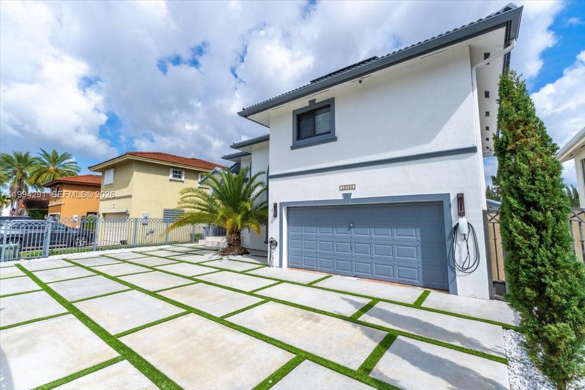 15763 Southwest 43rd Street Miami, FL 33185 - Photo 42 of 46 a house view with a outdoor space