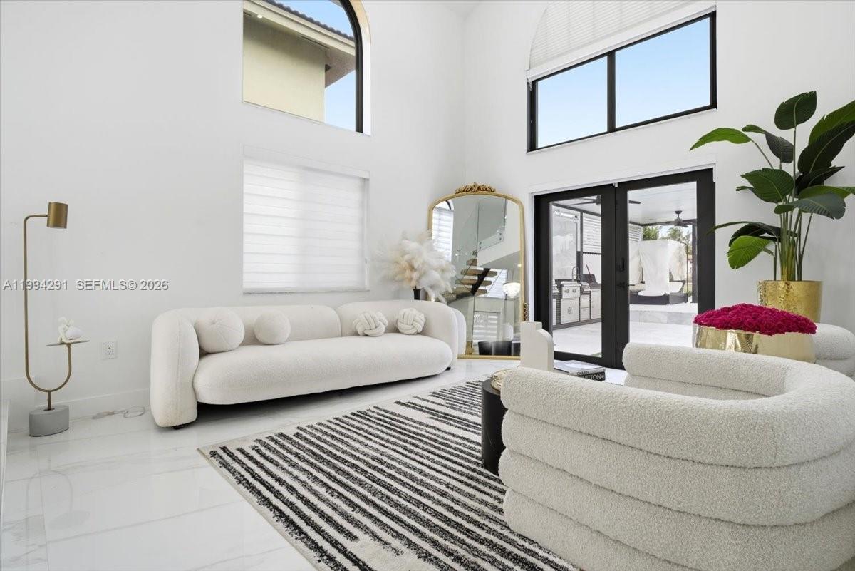 15763 Southwest 43rd Street Miami, FL 33185 - Photo 6 of 46 a living room with furniture and white floor