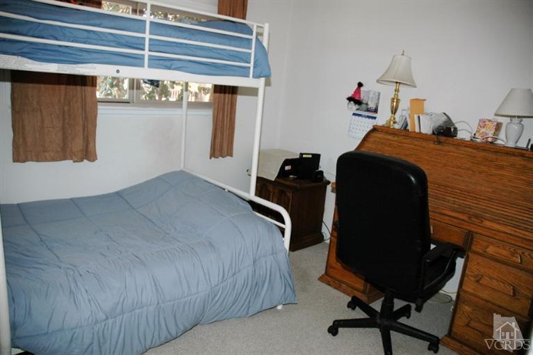 1764 Fitzgerald Road Simi Valley, CA 93065 - Photo 4 of 16 a bedroom with a bed and cabinets