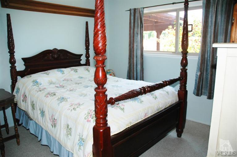 1764 Fitzgerald Road Simi Valley, CA 93065 - Photo 5 of 16 a bed sitting in a bedroom next to a window