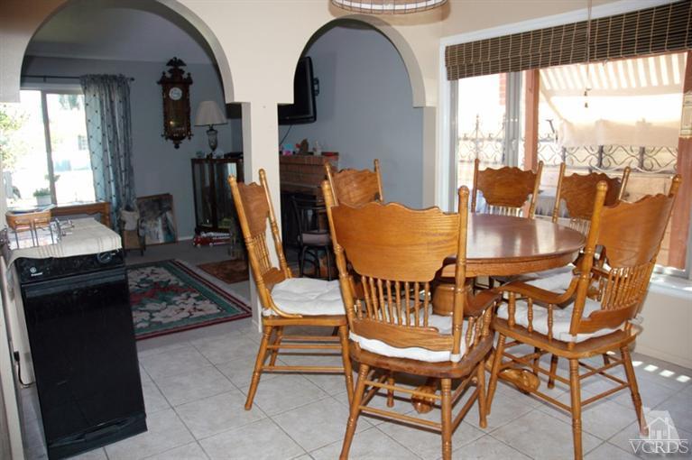 1764 Fitzgerald Road Simi Valley, CA 93065 - Photo 8 of 16 a dining room with furniture and a floor to ceiling window