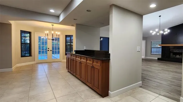 a kitchen with stainless steel appliances granite countertop wooden cabinets a sink and a stove