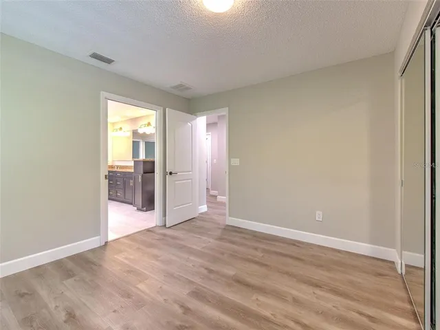 a large bathroom with a large mirror vanity and sink