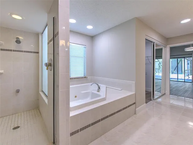 a bathroom with a double vanity sink and a bathtub