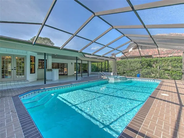 a view of swimming pool with a patio