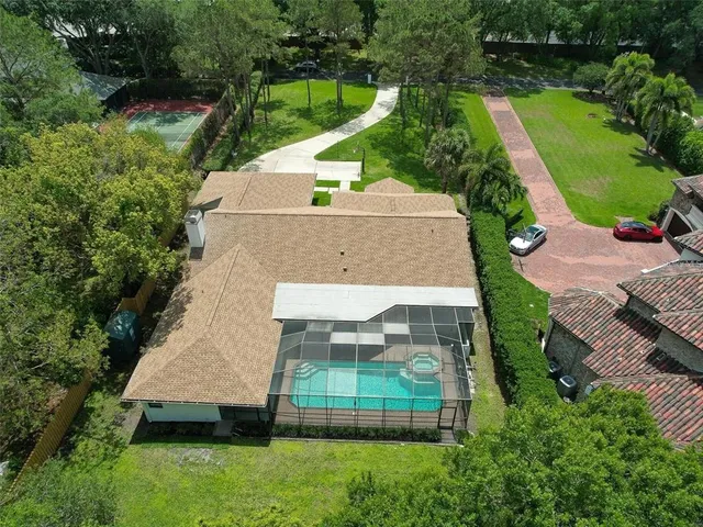 an aerial view of residential house with outdoor space and lake view
