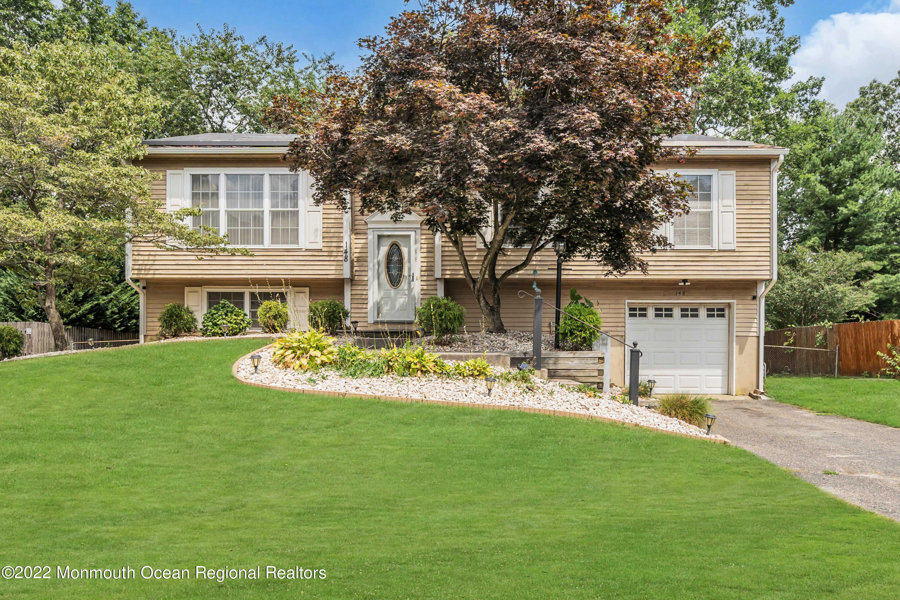 148 Weldon Road Manchester Township, NJ 08759 - Photo 1 of 36 a view of a house with a yard and sitting area