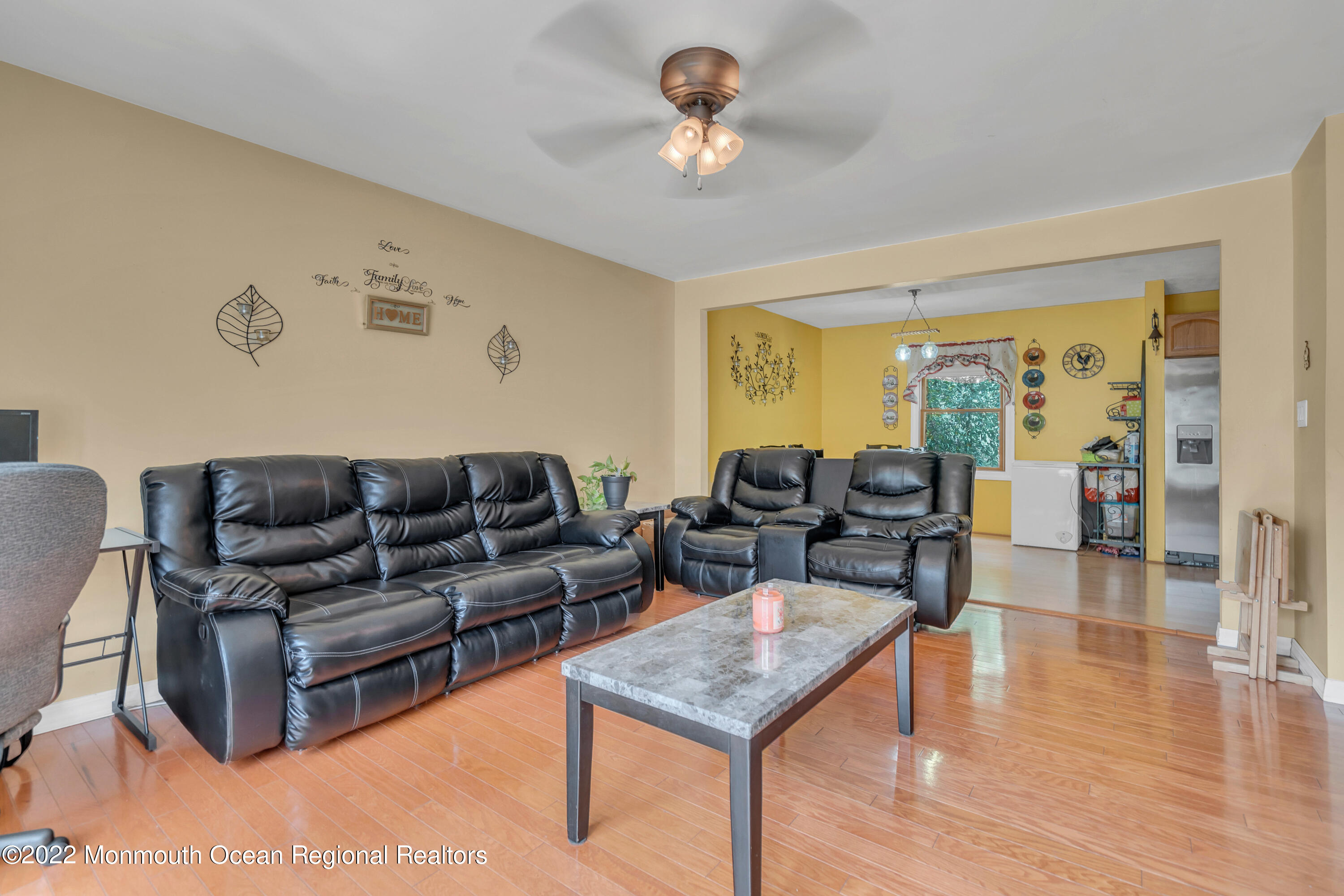 148 Weldon Road Manchester Township, NJ 08759 - Photo 11 of 36 a living room with furniture a table and wooden floor