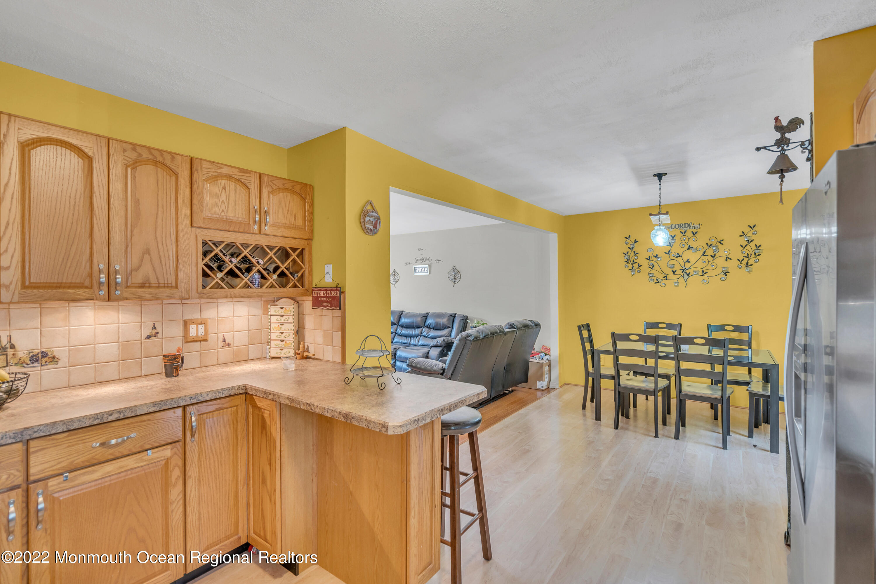 148 Weldon Road Manchester Township, NJ 08759 - Photo 19 of 36 a kitchen with a sink stove and chairs