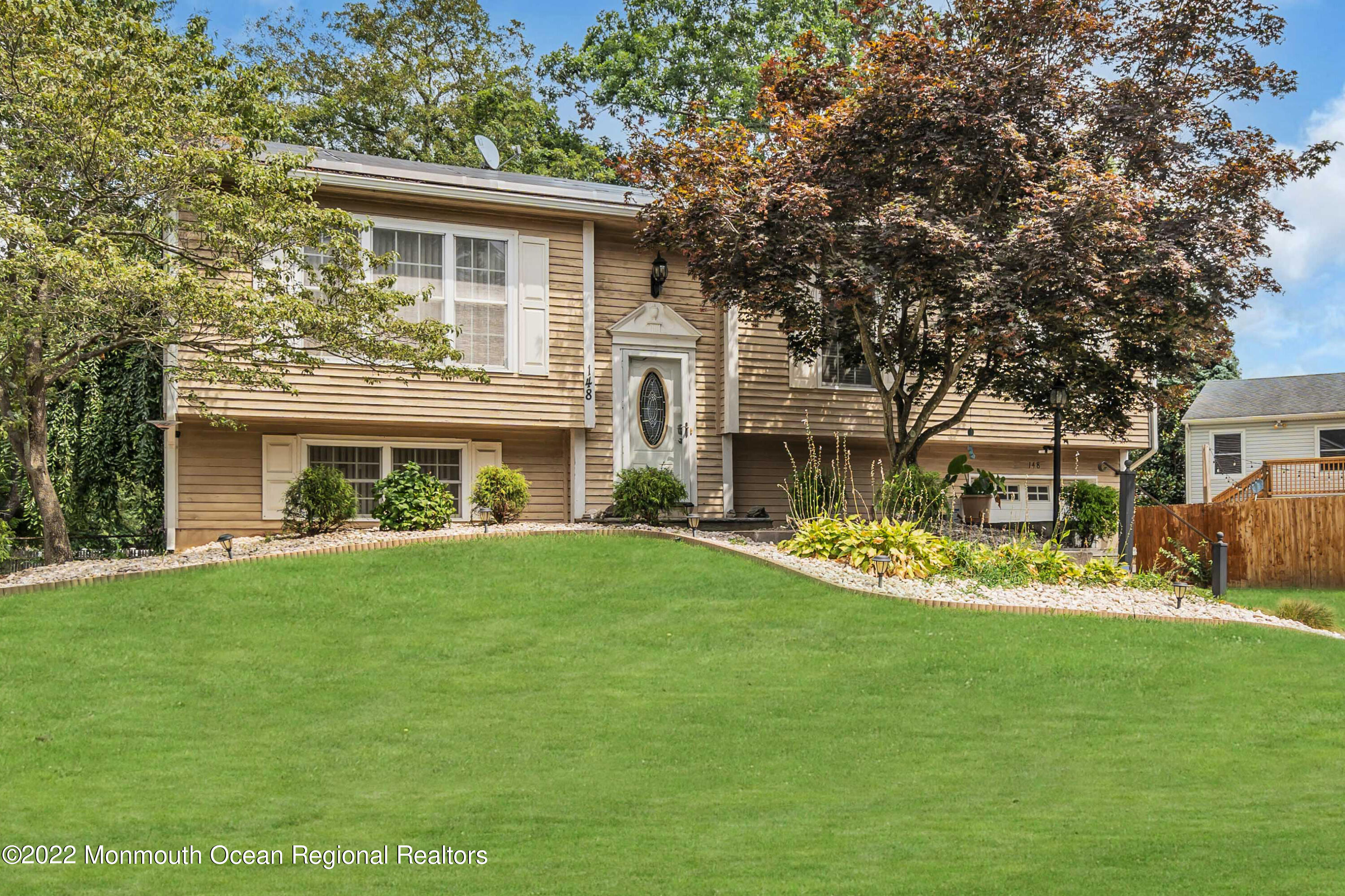 148 Weldon Road Manchester Township, NJ 08759 - Photo 2 of 36 front view of a house with a yard