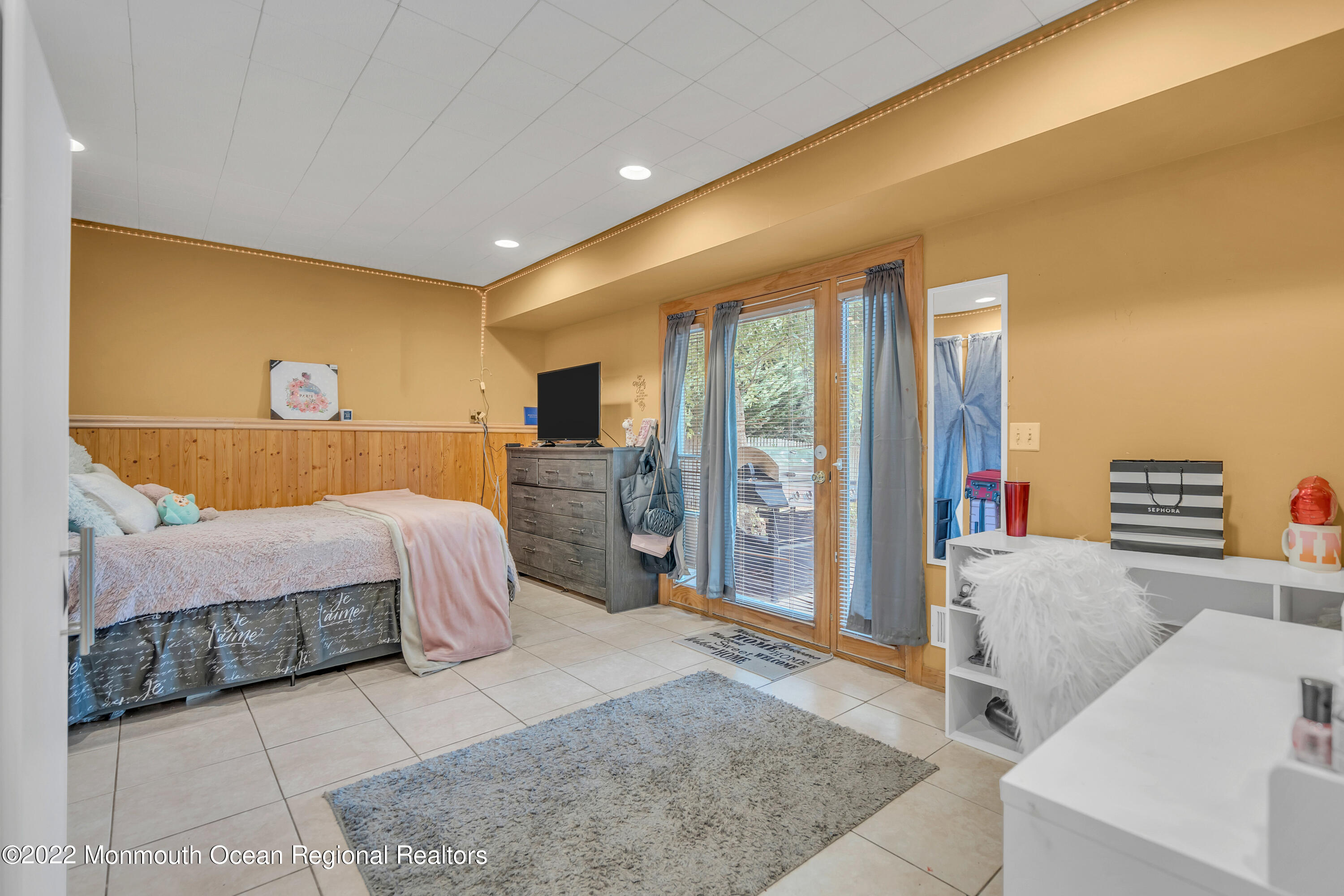 148 Weldon Road Manchester Township, NJ 08759 - Photo 21 of 36 a spacious bedroom with a bed and glass door