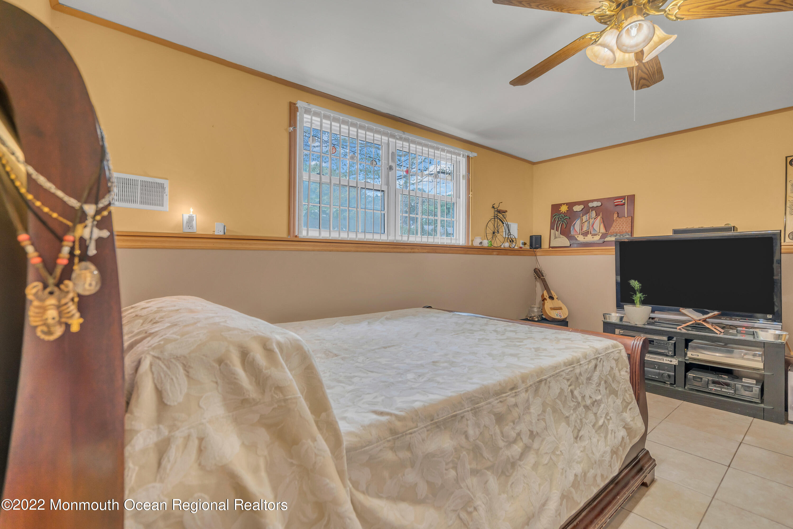 148 Weldon Road Manchester Township, NJ 08759 - Photo 22 of 36 a bedroom with a bed and a flat screen tv