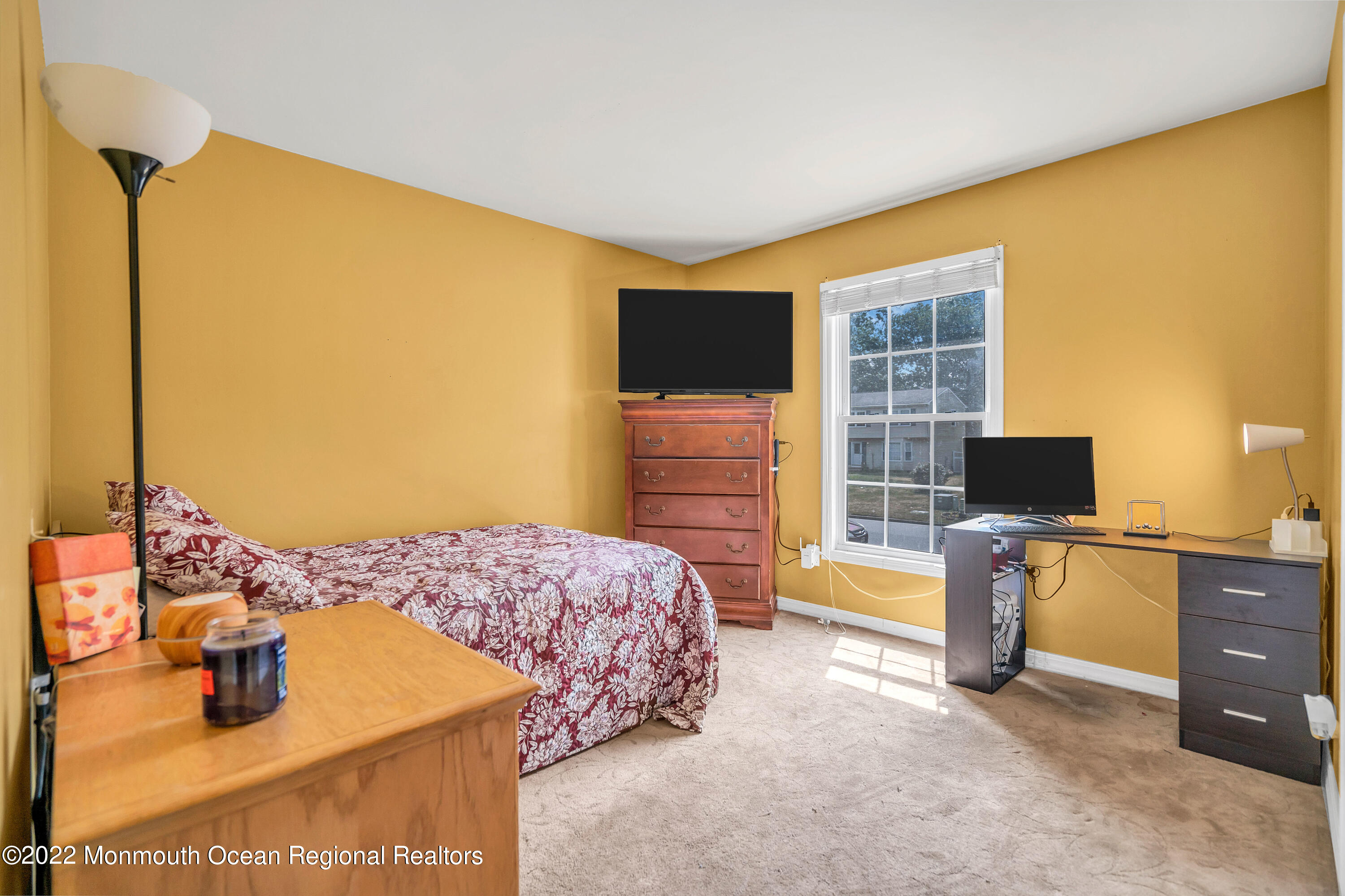 148 Weldon Road Manchester Township, NJ 08759 - Photo 28 of 36 a bedroom with a bed and flat screen tv