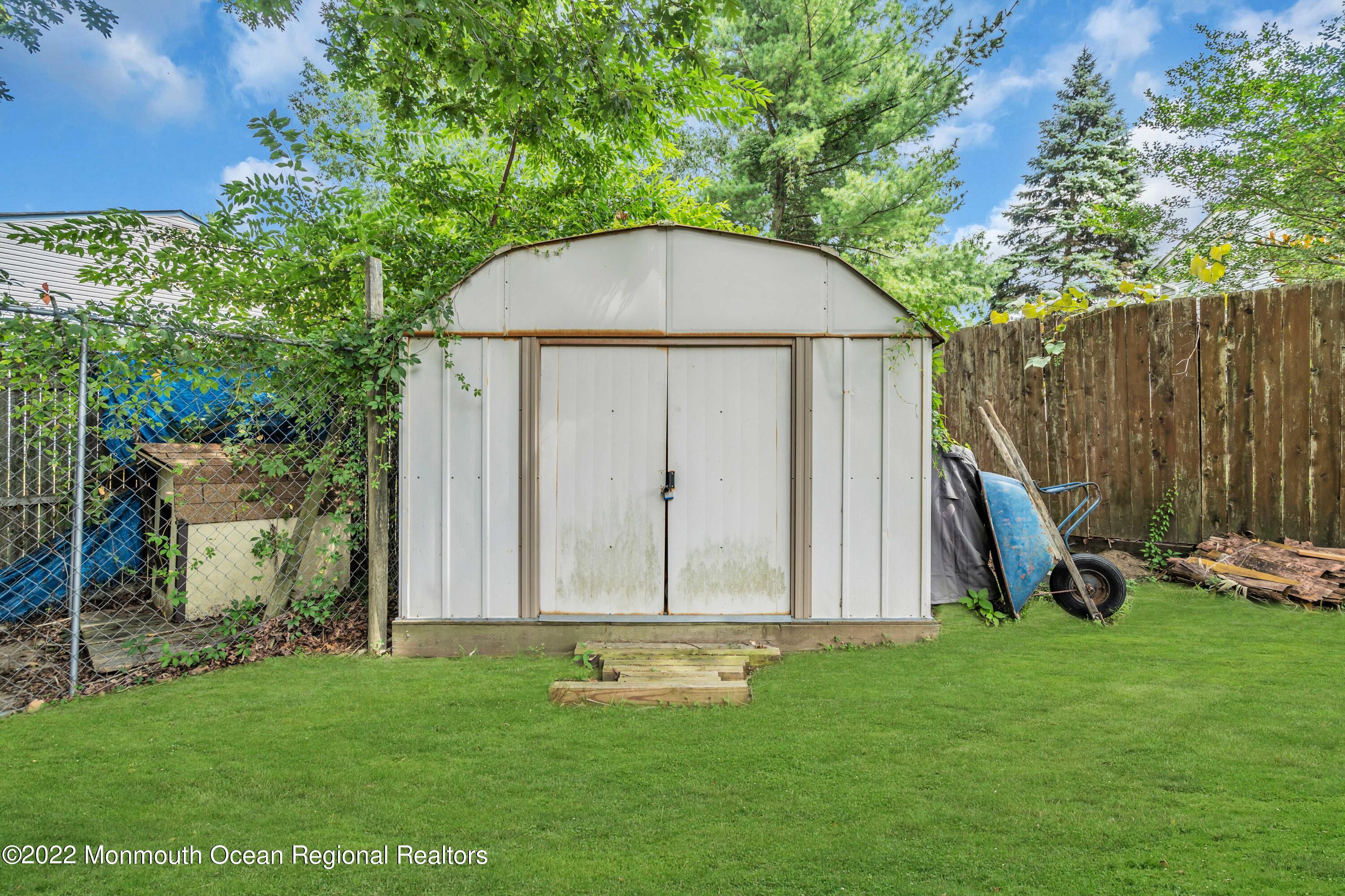 148 Weldon Road Manchester Township, NJ 08759 - Photo 33 of 36 a view of a backyard with a garden and entertaining space
