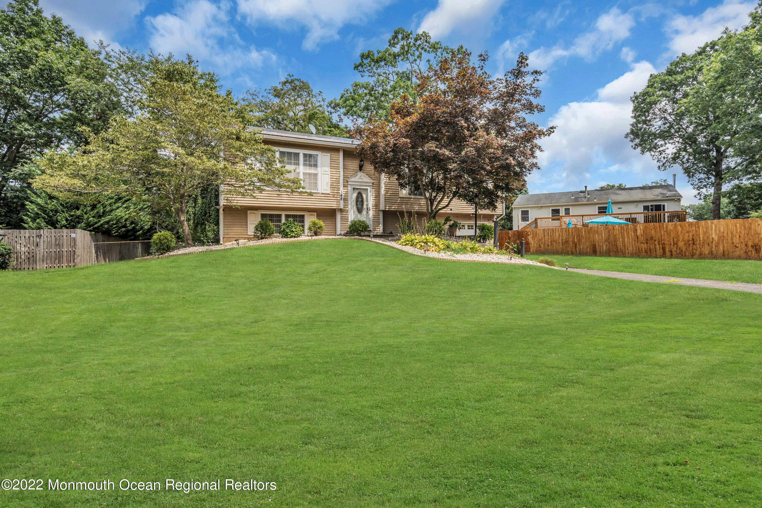 148 Weldon Road Manchester Township, NJ 08759 - Photo 5 of 36 a view of a house with a yard