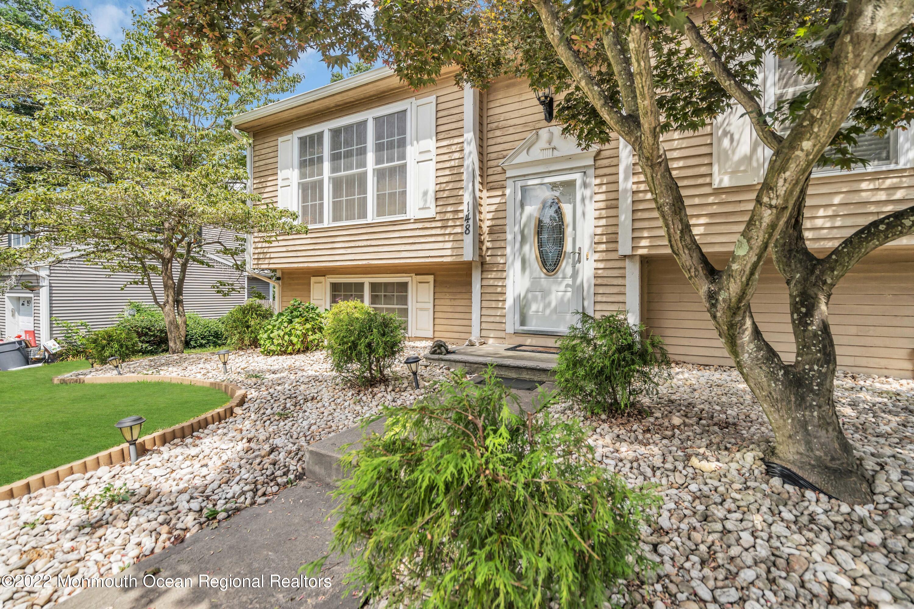 148 Weldon Road Manchester Township, NJ 08759 - Photo 7 of 36 front view of a house with a yard