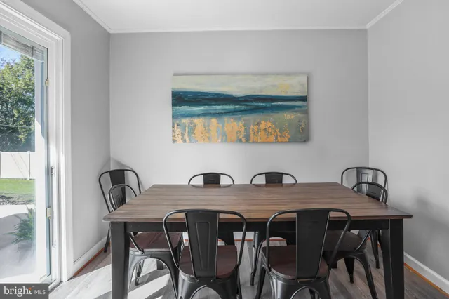 a view of a dining table and chairs in a room