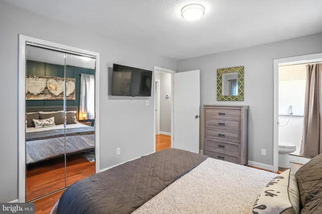 a bedroom with a large bed and a large window