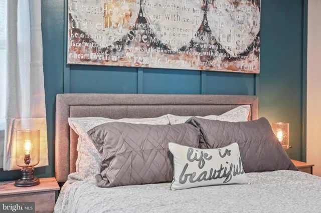 a bedroom with a bed and furniture