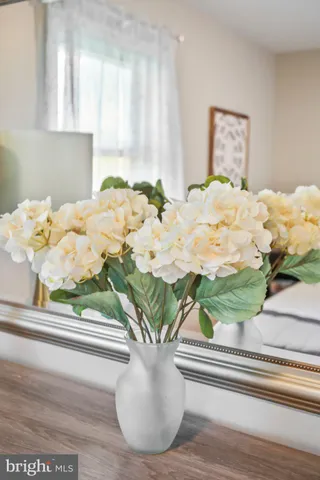 a bathroom with a toilet a sink and the mirror