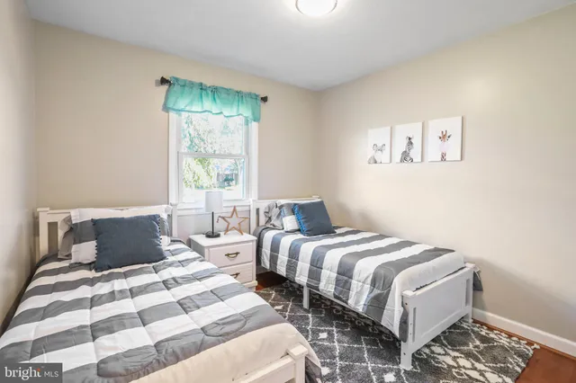 a white vase with white and yellow flowers