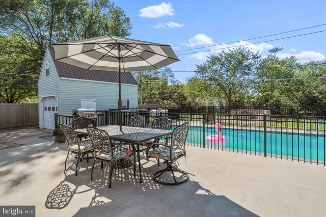 a patio with table and chairs