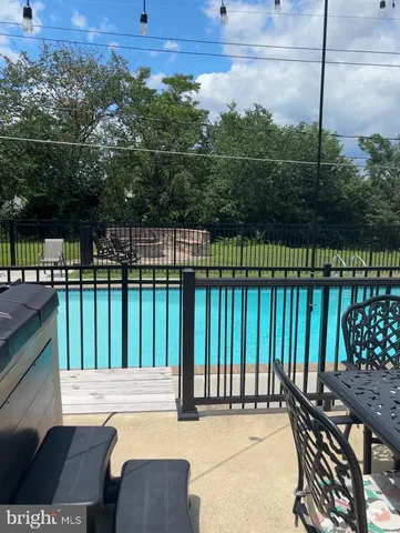 a view of a balcony with wooden floor and outdoor seating