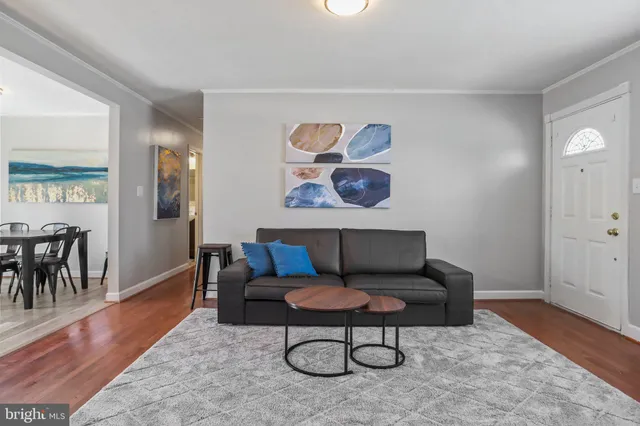 a living room with furniture and a rug