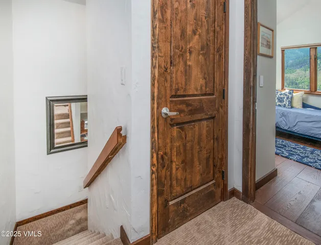a kitchen with a refrigerator and cabinets