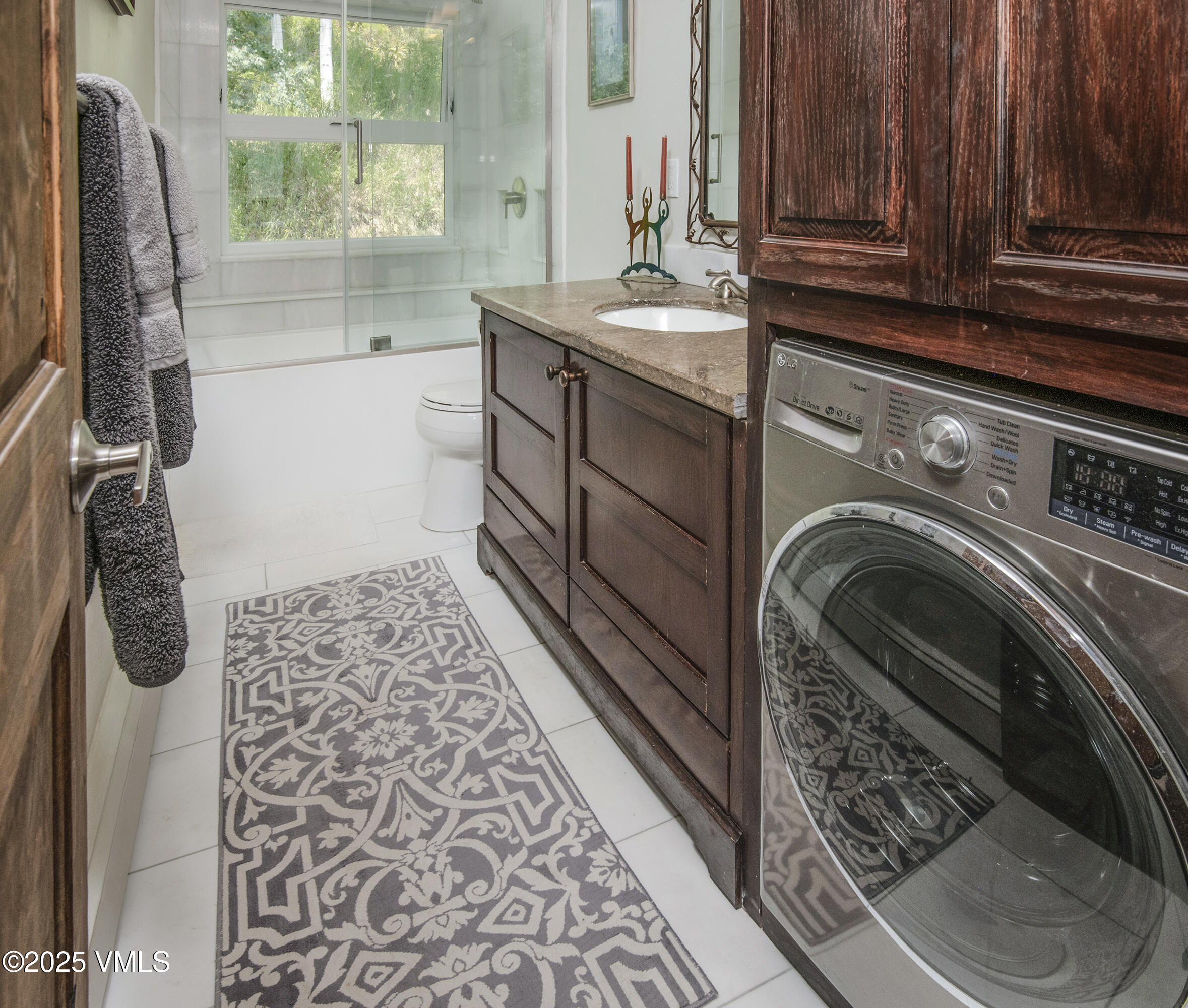 2653 Cortina Lane, Unit 5A Vail, CO 81657 - Photo 15 of 39 a bathroom with a sink a toilet and a shower