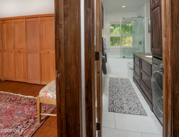 a view of a town with mountains in the background