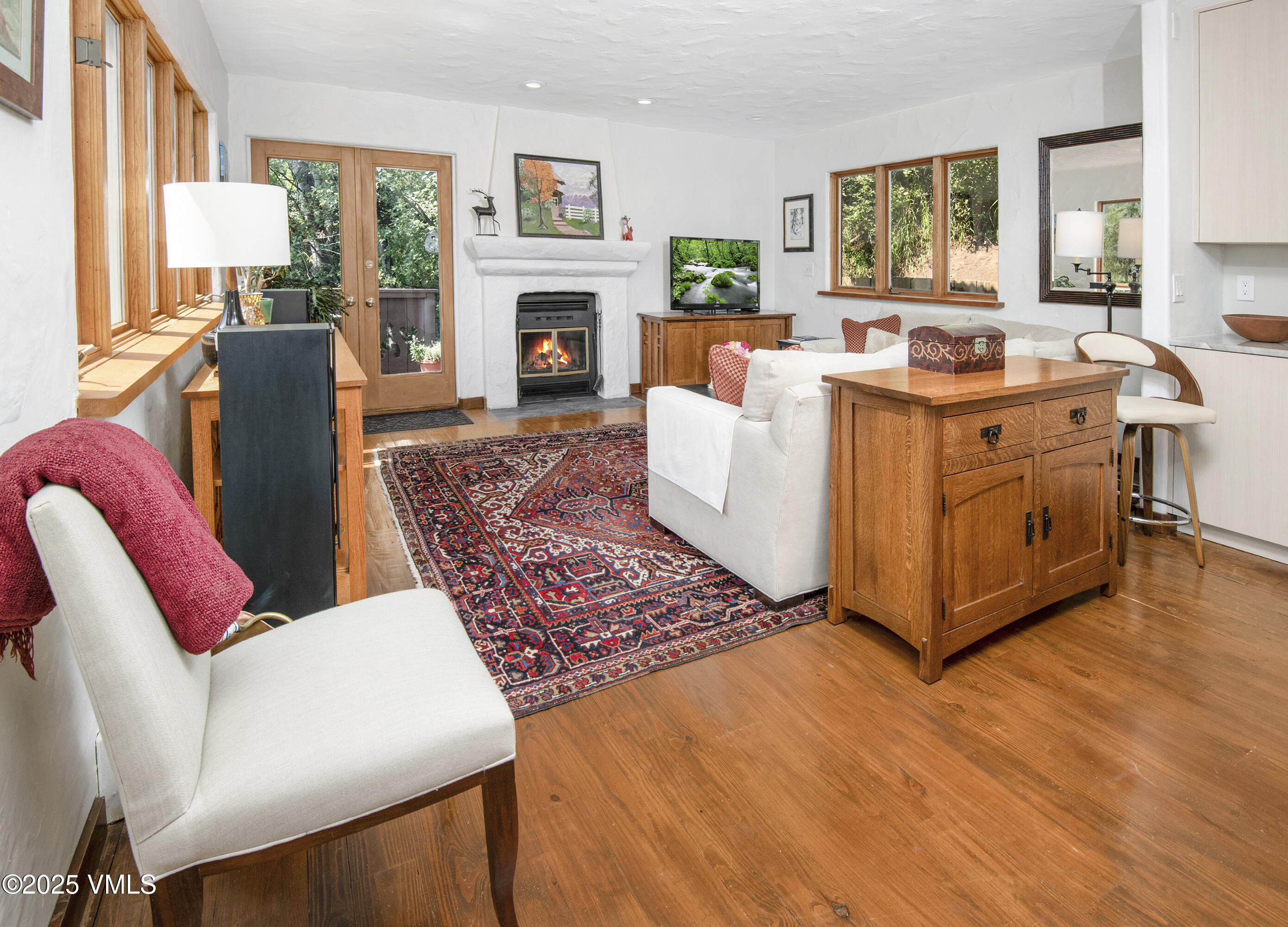 2653 Cortina Lane, Unit 5A Vail, CO 81657 - Photo 4 of 39 a living room with furniture a fireplace and a window