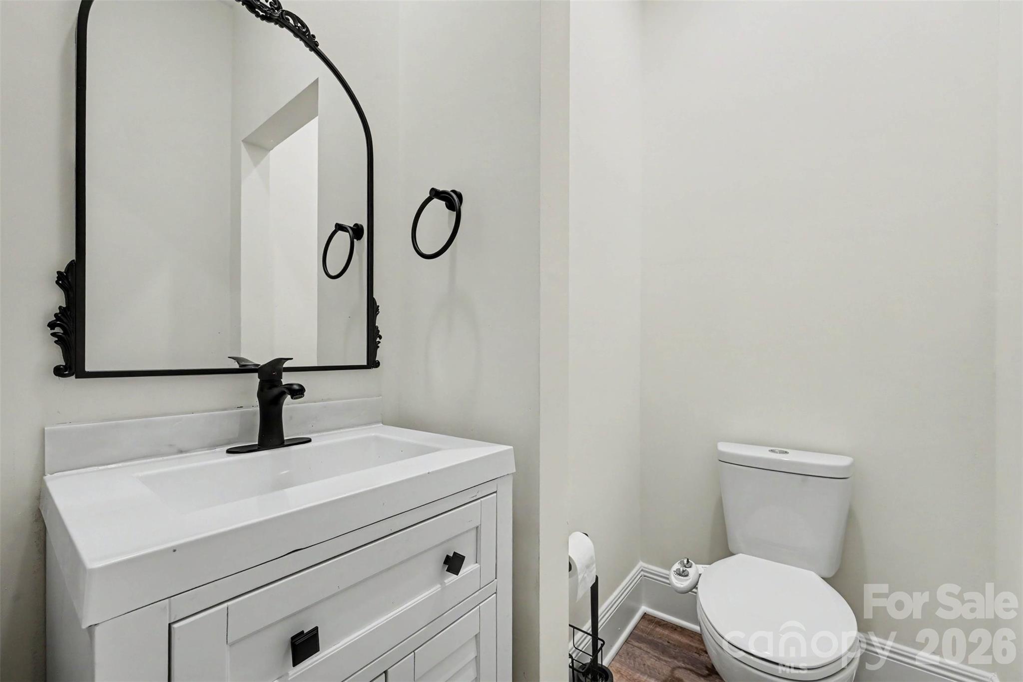 31 Ridgecrest Avenue Peachland, NC 28133 - Photo 26 of 30 a bathroom with a sink a toilet and a mirror