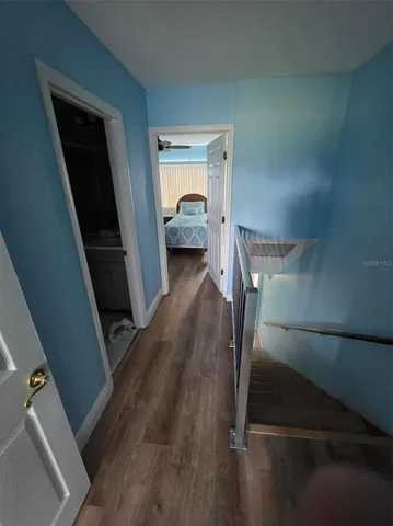 a view of a hallway view with staircase