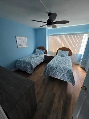 a bedroom with furniture and a window