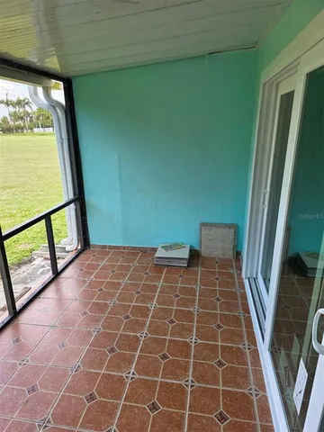a rug of a house with a sink and a large window