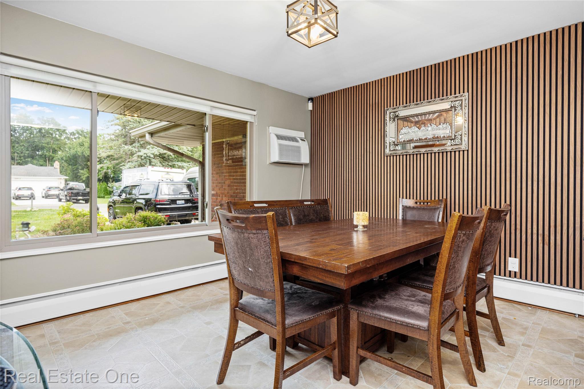 2810 Walbridge Drive Rochester, MI 48307 - Photo 20 of 58 Dining area featuring a decorative slat wall and a large picture window