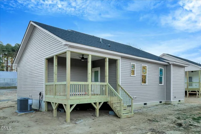 a view of small house and outdoor space