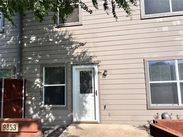 a front view of a house with a garage