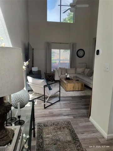 a living room with furniture and a window