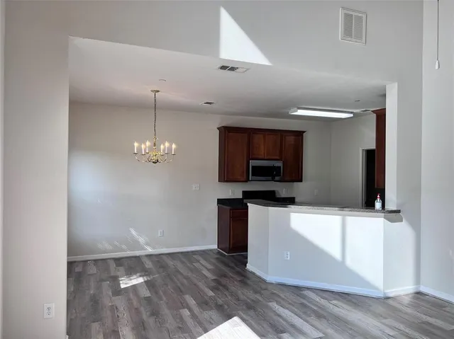 a kitchen with a sink and a microwave