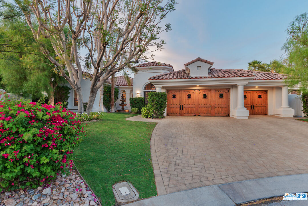 53 Vista Encantada Rancho Mirage, CA 92270 - Photo 1 of 33 a front view of house with yard